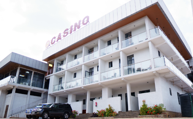 Photo gallery of Fanfare Suites Kigali showing hotel exterior, stylish rooms, and night views for an immersive guest experience