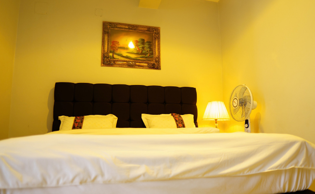 Photo gallery of Fanfare Suites Kigali showing hotel exterior, stylish rooms, and night views for an immersive guest experience