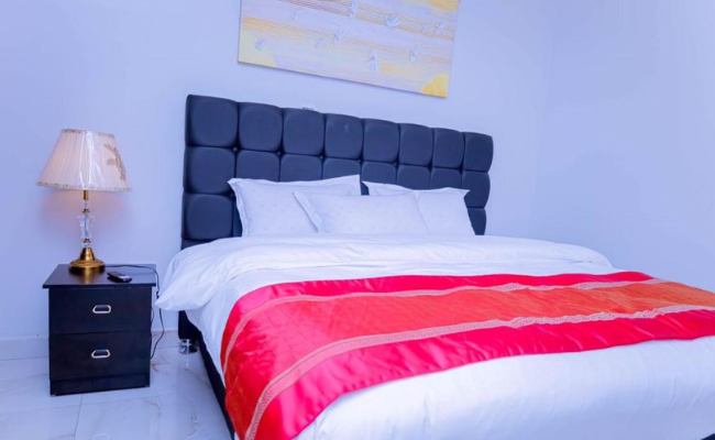 Photo gallery of Fanfare Suites Kigali showing hotel exterior, stylish rooms, and night views for an immersive guest experience