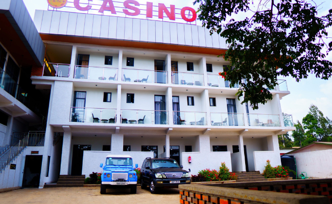 Photo gallery of Fanfare Suites Kigali showing hotel exterior, stylish rooms, and night views for an immersive guest experience